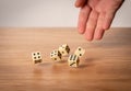 Hand throwing dice in front of a dark background Royalty Free Stock Photo