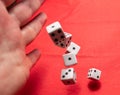 Hand throwing dice, hoping for the best odds Royalty Free Stock Photo