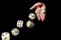 Hand throwing dice towards viewer Royalty Free Stock Photo