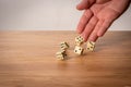 Hand throwing five dice on a wooden table Royalty Free Stock Photo