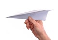 Hand throwing paper plane