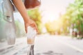 Hand throwing plastic bottle on the road Royalty Free Stock Photo