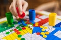 Hand throwing two dices playing Parcheesi, Parchis game