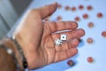 Hand that throws two playing dice, in addition to the classic game of dice there are many other games that use the dice to be able
