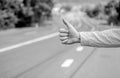 Hand thumb up gesture try stop car road background. Thumb or hand gesture hitchhiking. Make sure you know right gestures Royalty Free Stock Photo