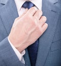 hand tie necktie of man in suit closeup, formal fashion