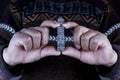 The hand of a Tiwanaku Indian holds a Bennett Monolith