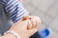 Hand to hand. An adult female hand holds a child`s hand. Royalty Free Stock Photo