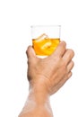 Hand toasting a glass of whiskey on the rocks Royalty Free Stock Photo