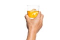 Hand toasting whiskey on the rock with white background Royalty Free Stock Photo