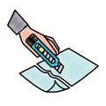 hand with the tool cutting a paper