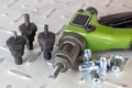 Hand tool, riveting and interchangeable nozzles for installation of steel carving rivets Royalty Free Stock Photo