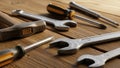Hand tools on a wooden surface include a hammer wrenches and screwdriv Royalty Free Stock Photo