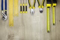 Hand tools in workshop on natural wood background. Top view with copy space