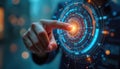 Hand touches virtual interface with glowing orange point. Futuristic technology concept with circular digital screen displaying Royalty Free Stock Photo