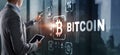 Hand touching Bitcoin button. Modern business technology concept. Bitcoin, Ethereum