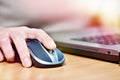 Hand touching computer mouse Royalty Free Stock Photo