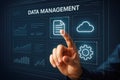 Hand touching digital interface screen displaying data management icons and charts touchscreen finger Royalty Free Stock Photo