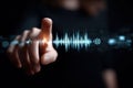 Hand touching a digital sound wave interface representing audio technology and sound interaction Royalty Free Stock Photo