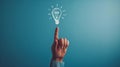 A hand touching a drawn lightbulb symbolizing an idea on a teal background.. AI generated Royalty Free Stock Photo