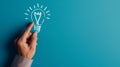 A hand touching a drawn lightbulb symbolizing an idea on a teal background.. AI generated Royalty Free Stock Photo