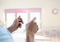 Hand touching glass screen at home Royalty Free Stock Photo