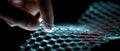 Hand touching glowing hexagonal grid representing advanced technology and innovation Royalty Free Stock Photo