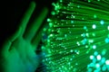 Hand touching green fiber optics Royalty Free Stock Photo