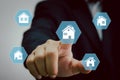 Hand touching icon house.Real estate concept business, home insurance and real estate protection. Buy and sell houses and real Royalty Free Stock Photo