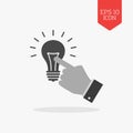 Hand touching light bulb icon, reach the idea concept. Flat design gray color symbol. Modern UI web navigation, sign. Royalty Free Stock Photo