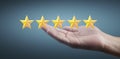 Hand of touching rise on increasing five stars. Increase rating evaluation  classification concept Royalty Free Stock Photo