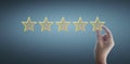 Hand of touching rise on increasing five stars. Increase rating evaluation  classification concept Royalty Free Stock Photo