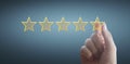 Hand of touching rise on increasing five stars. Increase rating evaluation  classification concept Royalty Free Stock Photo