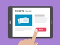 Hand touching screen of tablet computer with buy button and tickets icon on screen. Concept of online tickets mobile Royalty Free Stock Photo