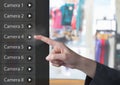 Hand Touching Security camera App Interface clothes shop Royalty Free Stock Photo