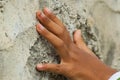 a hand touching stone wall Royalty Free Stock Photo
