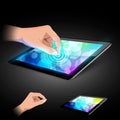 Hand is touching tablet pc to make gesture.