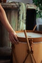 Hand touching a traditional wooden Bombo leguero drum of with blur background