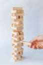 Hand and tower of wooden blocks Royalty Free Stock Photo