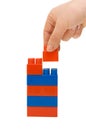 Hand and toy tower Royalty Free Stock Photo