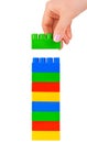 Hand and toy tower Royalty Free Stock Photo