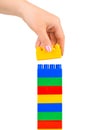 Hand and toy tower Royalty Free Stock Photo
