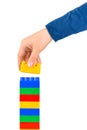 Hand and toy tower Royalty Free Stock Photo