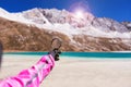 Hand traveler woman holding magnifying glass at mountain,Navigation for travel,Close up