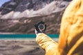 Hand traveler woman holding compass at mountain,Navigational for travel,Close up