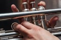 Hand of the Trumpeter on the buttons of trumpet Royalty Free Stock Photo