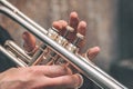 Hand of the Trumpeter on the buttons of trumpet Royalty Free Stock Photo