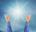 Hand trying to reach on the sky with sunshine rays Royalty Free Stock Photo
