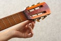 Hand tuning acoustic guitar Royalty Free Stock Photo