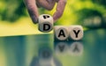 Hand is turning a dice and changes the word Pay to Day Royalty Free Stock Photo